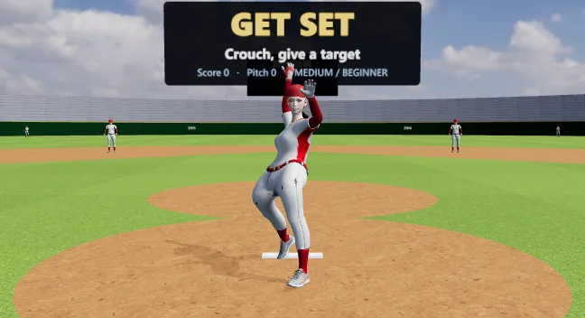A softball pitcher at the top of a windmill delivery